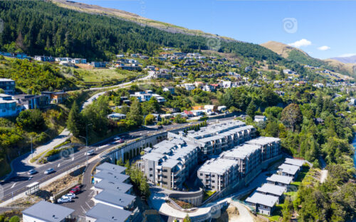 Aerial View from Houses close to the Beach, Lake Wakatipu, Green Trees, Mountains – Queenstown in New Zealand - NZ Stock Photos